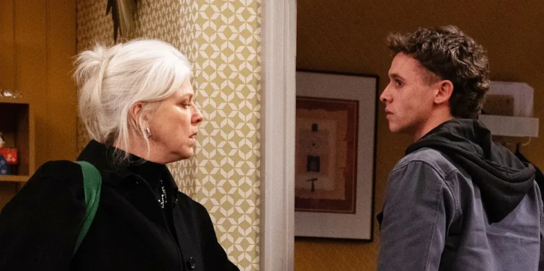 A dramatic scene from Emmerdale, featuring Dr Todd and Jacob, with a dark and moody colour scheme, highlighting the show's intense and suspenseful atmosphere, with a focus on Dr Todd's behaviour