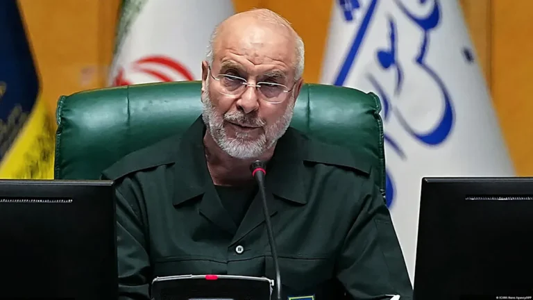 Iran and US flags waving together, symbolising the progress made in the war talks between the two nations, with a colour palette of blue and red, representing the two nations, and a white background, representing peace and unity, the primary keyword being Iran war