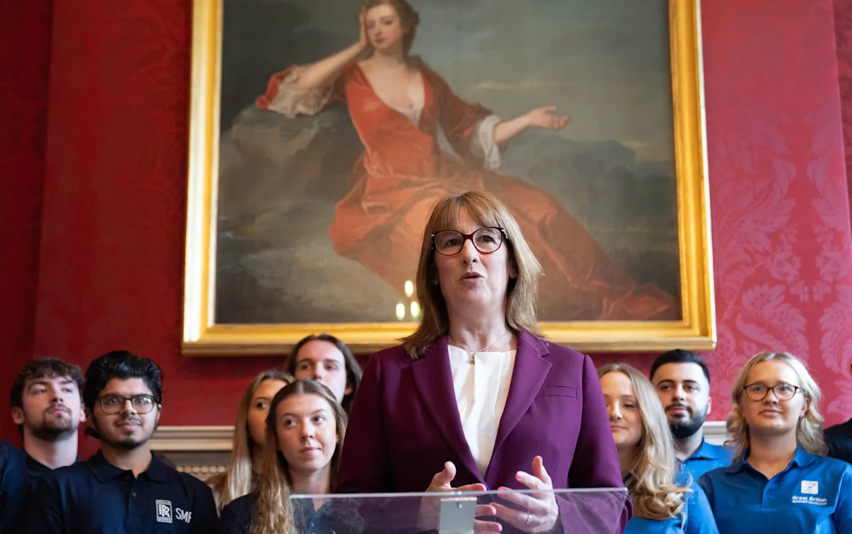 Energy bosses and Reeves in a meeting, discussing the future of the UK energy sector with a concerned expression, highlighting the primary keyword 'energy sector'