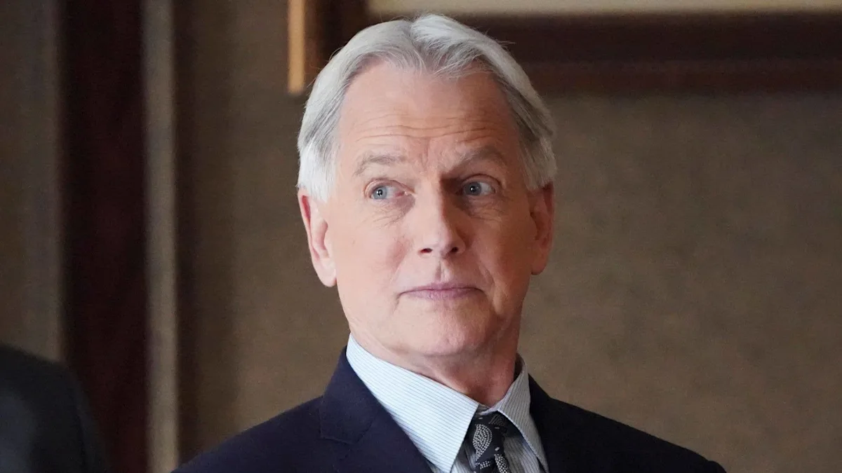 Mark Harmon with his wife Pam Dawber and their two children, Sean and Kristin, posing for a family photo, showcasing their love and bond, with a beautiful colour scheme in the background