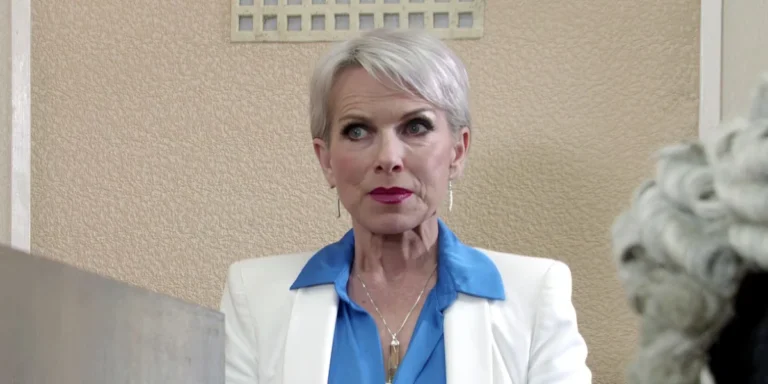 A screenshot of Coronation Street's Debbie, looking concerned and upset, with a blurred background of the soap opera's set, showcasing the show's dramatic and emotional storyline, with a focus on the character's behaviour and relationships