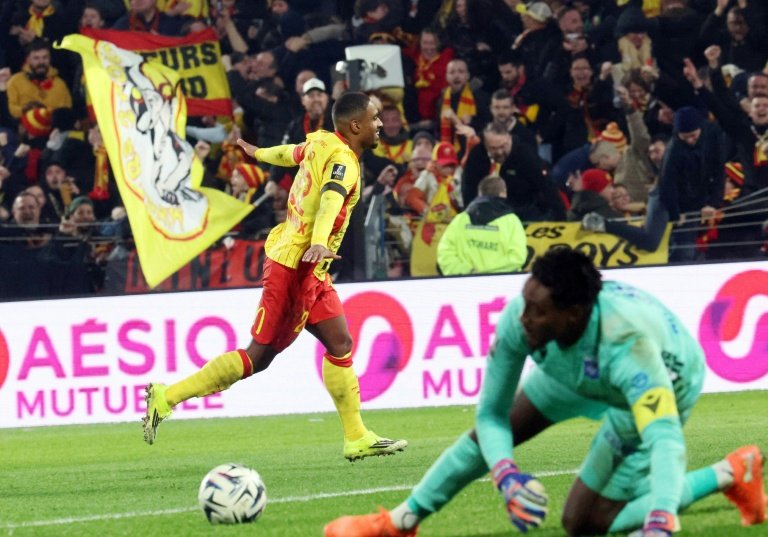 Lens players celebrating their win over Auxerre