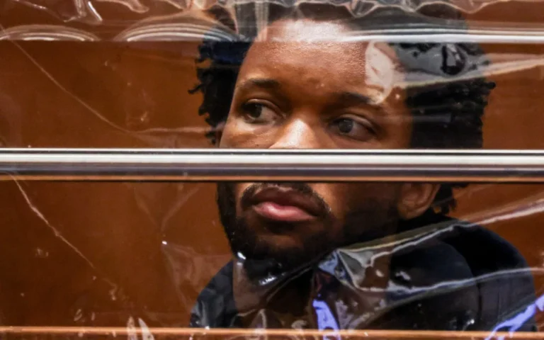 A singer holding a chainsaw, symbolising the allegations of abuse and intimidation, with a focus on the primary keyword phrase 'abuse allegations'