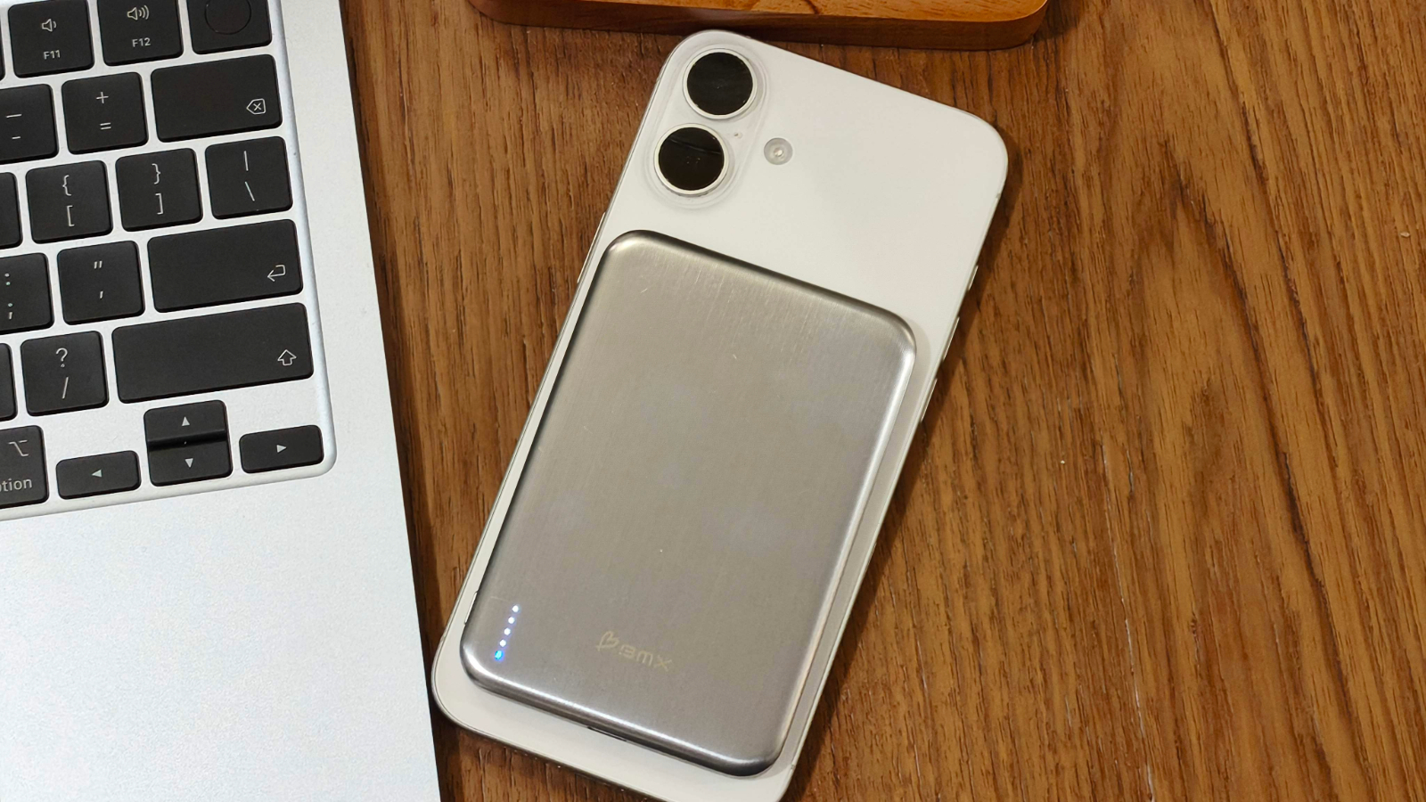 The BMX SolidSafe Air 5K power bank attached to an iPhone, showcasing its sleek and ultra-thin design, perfect for UK iPhone users seeking a reliable and stylish accessory