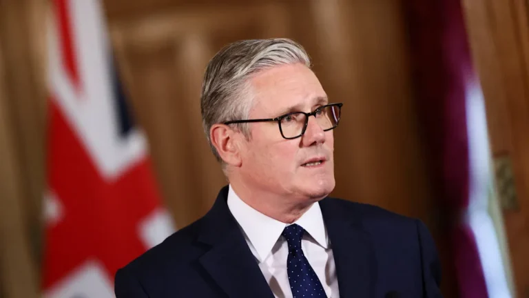A group of protesters holding signs and banners, with a focus on promoting peaceful and respectful dialogue, as Labour leader Keir Starmer condemns 'globalise the intifada' chants