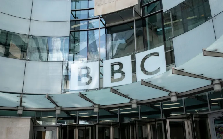 A photo of a BBC studio with a female presenter in the foreground, symbolising the alleged assault by a male presenter on a female colleague, highlighting the importance of workplace behaviour and accountability