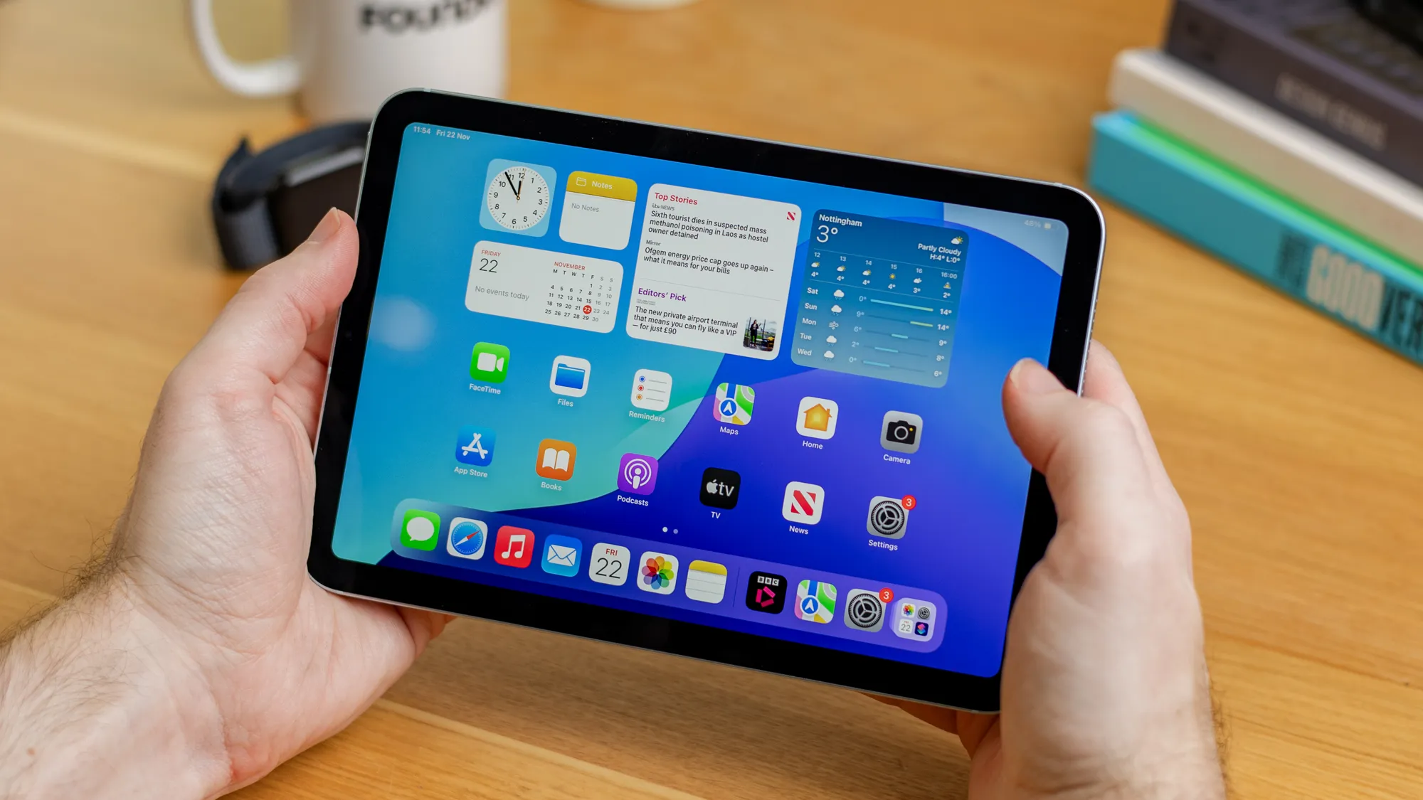 The iPhone Ultra, a foldable phone with a 4:3 aspect ratio, featuring a large screen and improved multitasking capabilities, perfect for productivity and usability in the UK