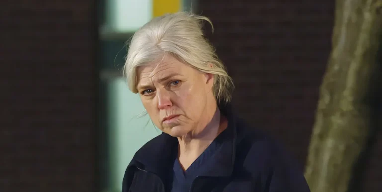 A dramatic image of Dr Todd from Emmerdale, with a shocked expression, set against a colourful background, representing the show's mix of drama and suspense, with a focus on the character's behaviour and the impact of his confession on the village