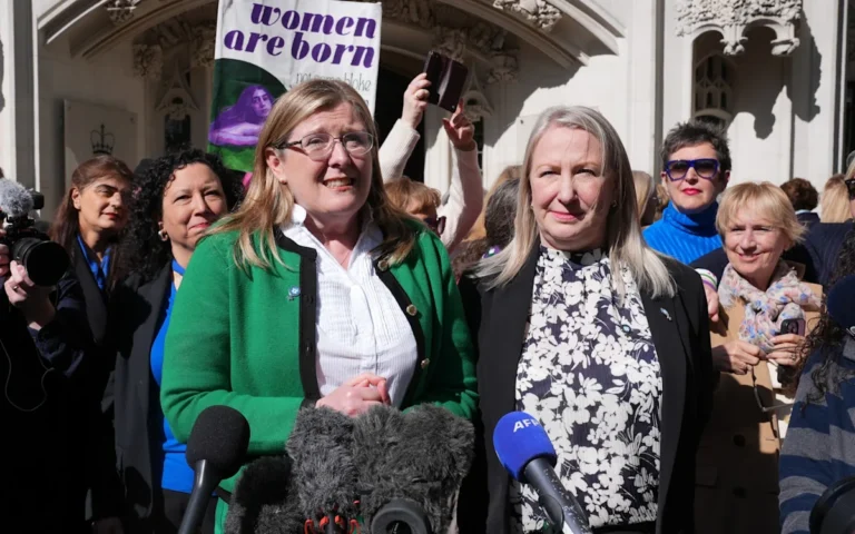 Wetherspoon pub sign with customers outside