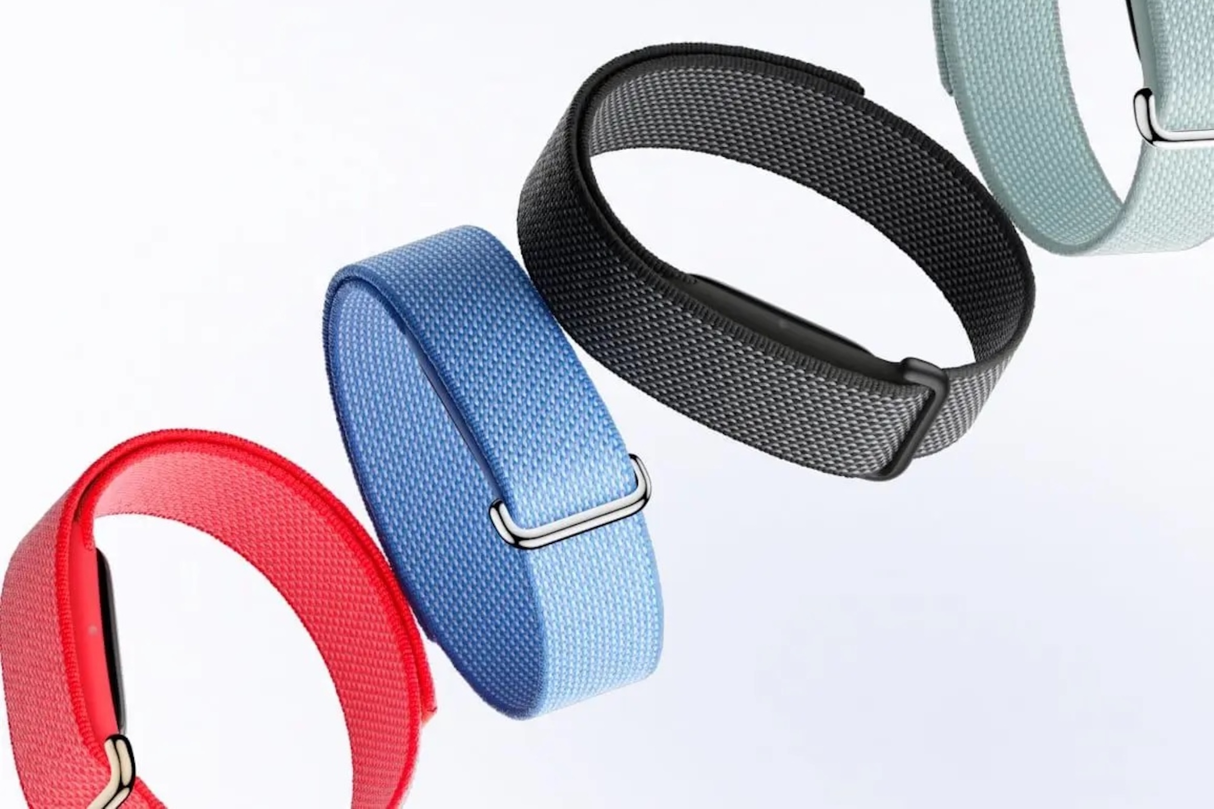 The Fitbit Air in various colour options, including Obsidian, Berry, Fog, and Lavender, with a focus on the screenless design and minimalist style, perfect for fitness enthusiasts in the UK who want a discreet and effective fitness tracker.