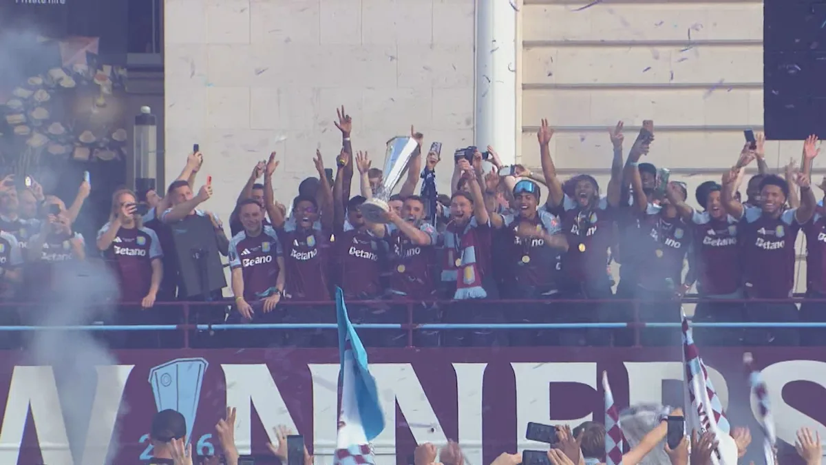 Aston Villa players and staff celebrate their Europa League win with a victory parade in Birmingham, surrounded by thousands of fans waving flags and banners in the team's colours