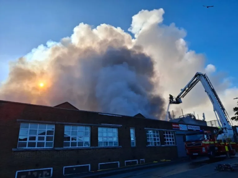 A large fire engulfs an industrial estate, with firefighters and emergency services responding to the scene. The fire is spreading rapidly, and the cause is currently unknown. Industrial estate fires can have devastating consequences, highlighting the importance of fire prevention and emergency preparedness. Fire services are working to contain the blaze and ensure everyone's safety