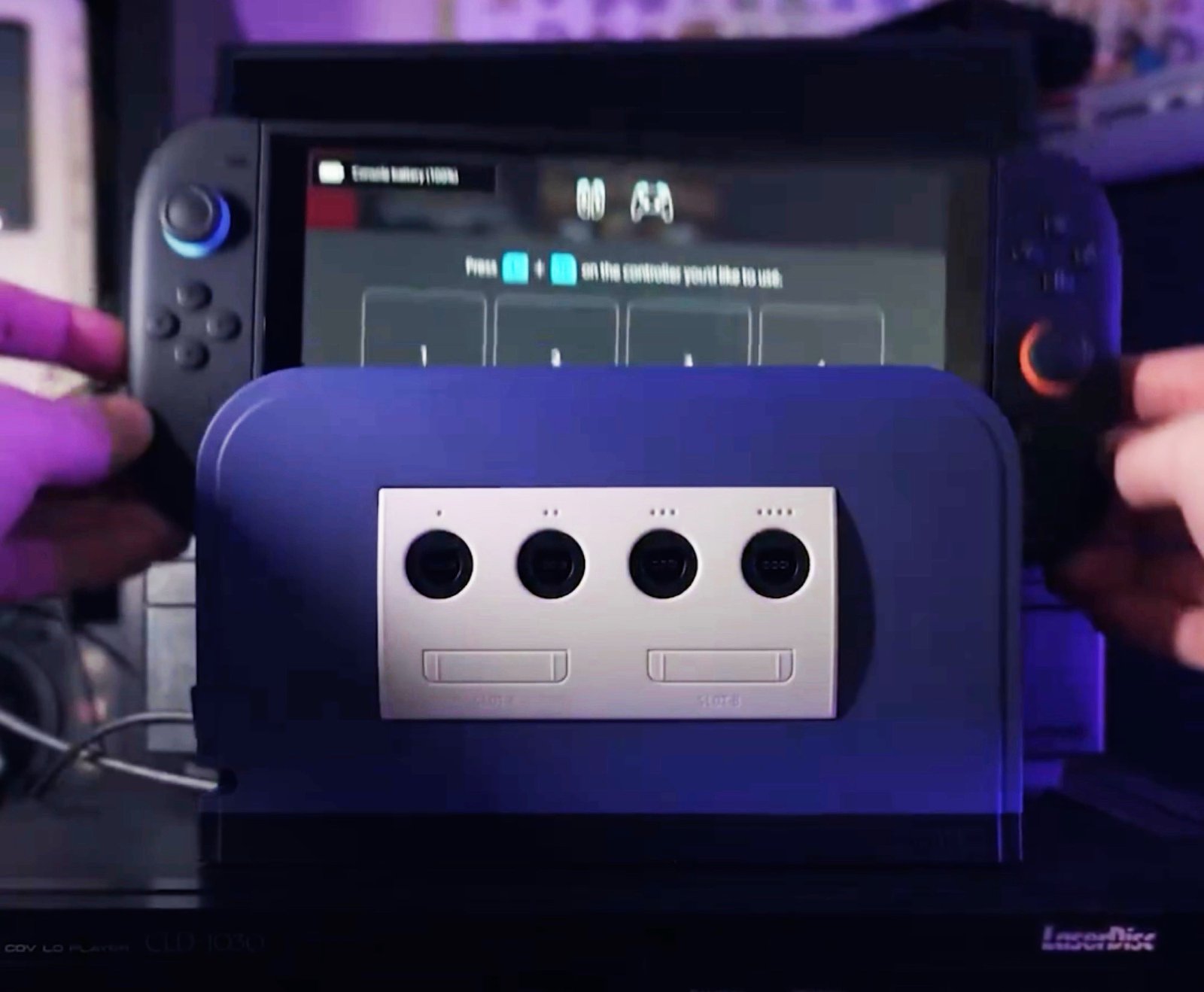The Battle Dock for Nintendo Switch 2, featuring a purple and gray colour scheme and four GameCube controller ports, perfect for retro gaming enthusiasts and fans of the GameCube console