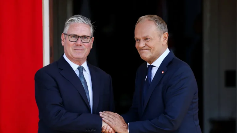 UK Labour leader Sir Keir Starmer and Polish politician Donald Tusk signing a defence pact, marking a new era in UK-Poland defence cooperation and European security, with a focus on joint military exercises and defence industry collaboration