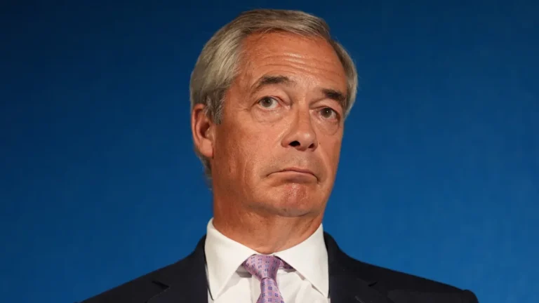 Nigel Farage speaking at a podium, with a caption referring to the airport trial and the Attorney General's involvement, highlighting the significance of the case and the potential consequences of the outcome, with a focus on the legal system and the behaviour of individuals in positions of power