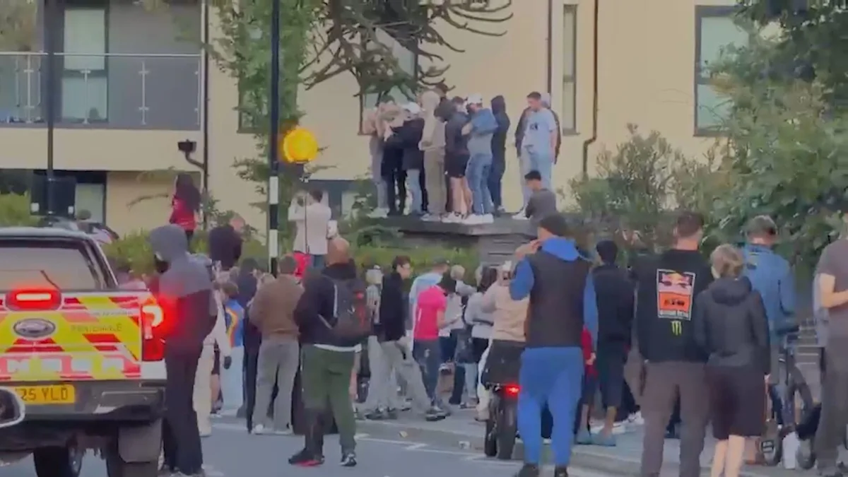 Riot police in Southampton clash with protesters, with banners and flags on display as the crowd demands change and justice, in a scene that highlights the need for a more nuanced approach to managing public demonstrations and protests