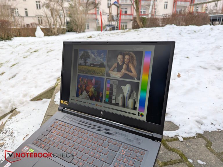 A close-up of the Acer Nitro V 17's display, showing its lack of brightness and colour accuracy, with a person in the background looking disappointed, highlighting the importance of a good display in a budget laptop