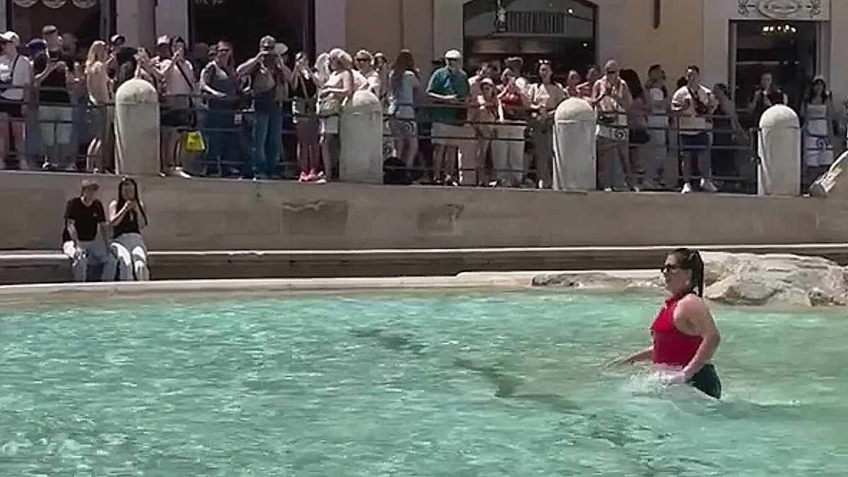 The Trevi Fountain in Rome, a beautiful and historic landmark, with its stunning baroque architecture and vibrant colour, attracting millions of visitors each year, and now at the centre of a controversy surrounding an influencer's ill-advised swim