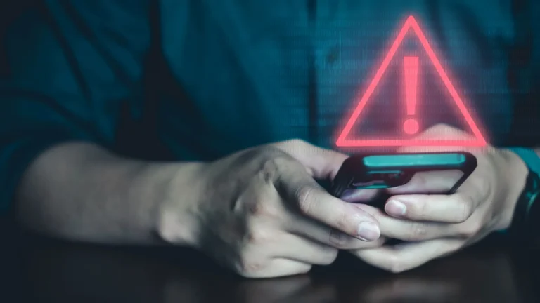 A person holding a smartphone with a concerned expression, surrounded by icons of various apps, highlighting the importance of data protection and online safety in the UK