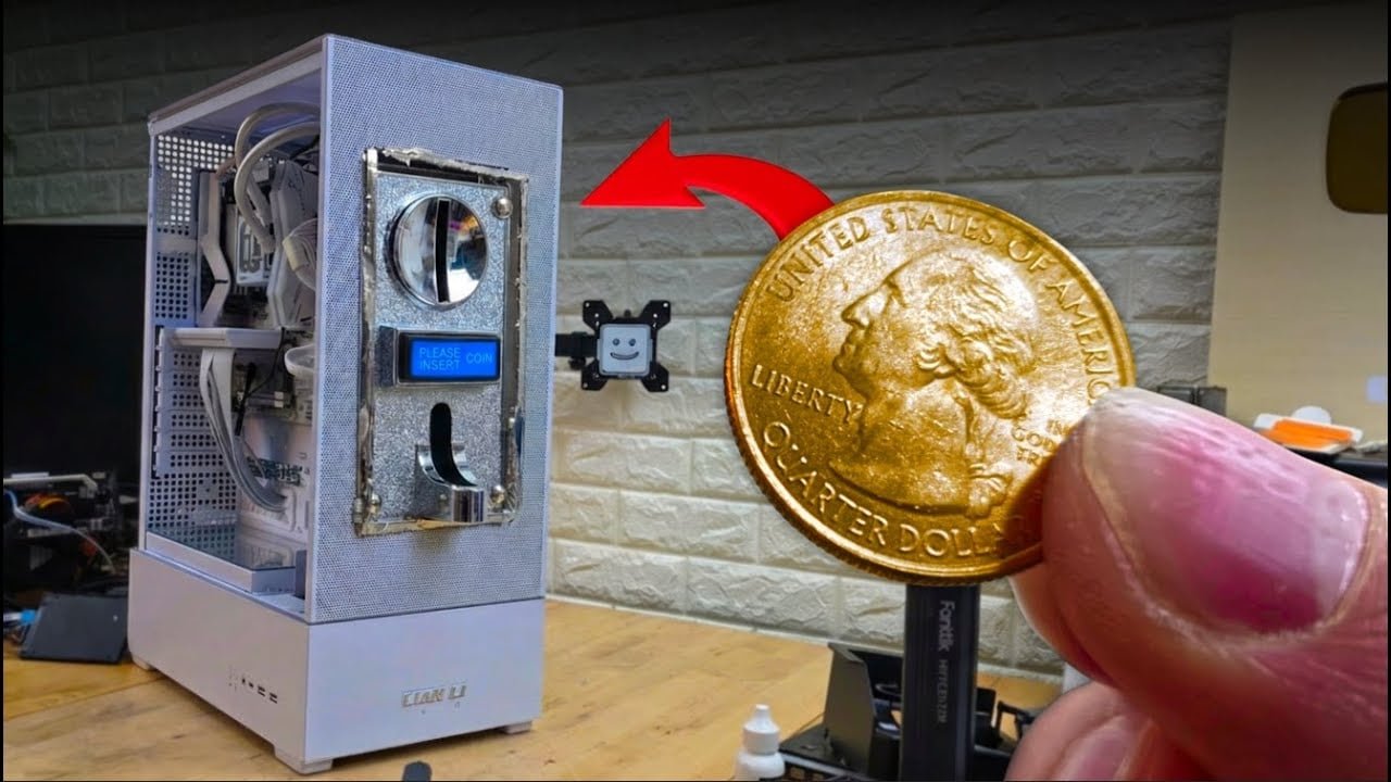 A coin-operated gaming PC with a coin acceptor, requiring a quarter to be inserted to power on the device, showcasing a unique and innovative gaming experience with a mix of nostalgia and cutting-edge technology.