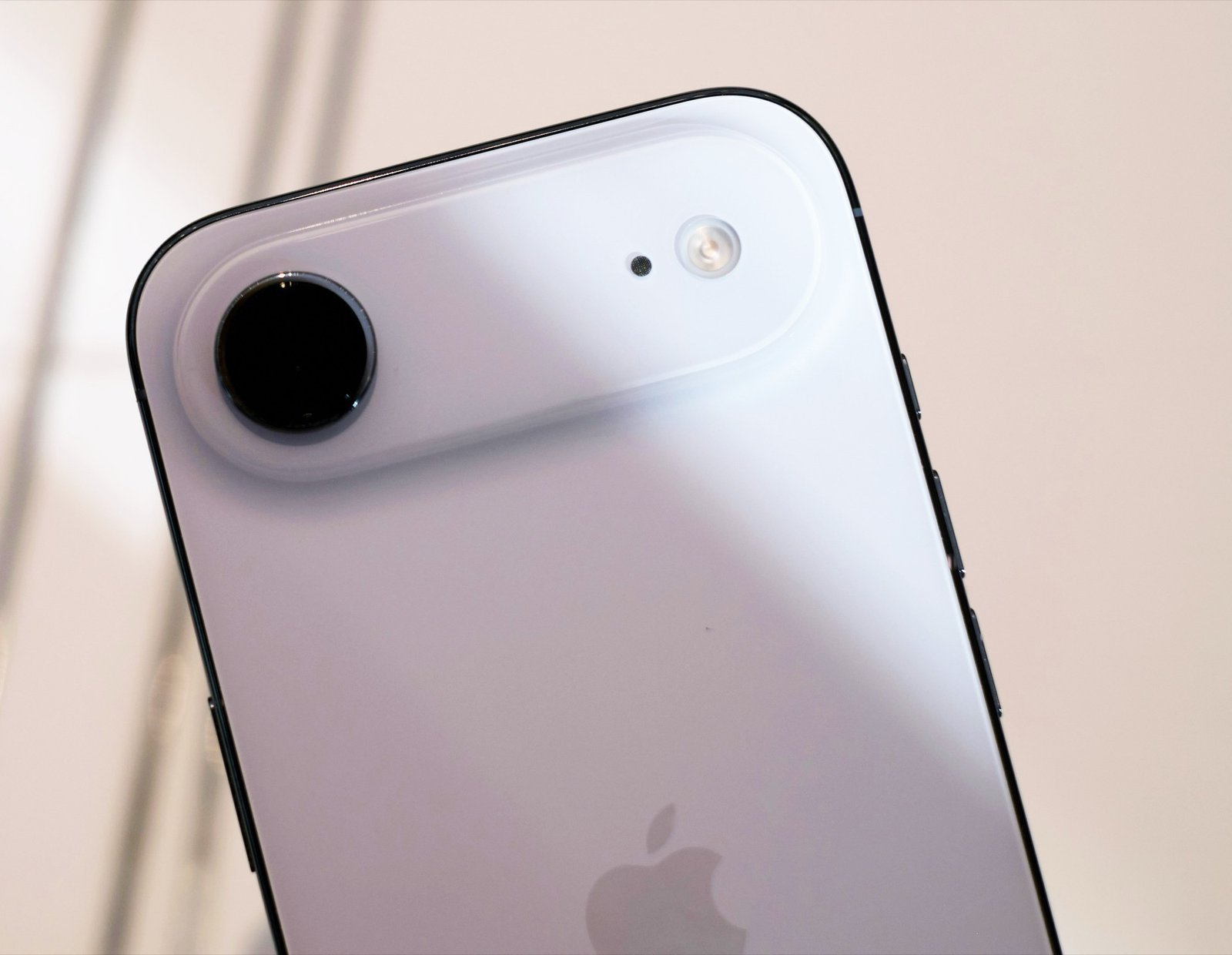 An artist's rendering of the iPhone Air 2, showcasing its sleek design and advanced camera system, complete with a smaller Face ID module, highlighting Apple's commitment to innovation and its pursuit of perfection in mobile technology