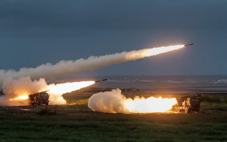 Taiwan's military personnel preparing to launch Himars missiles towards China, marking a significant escalation in tensions between the two nations, with the primary focus on testing the missile system's capabilities and accuracy in various scenarios, including the colour and behaviour of the situation