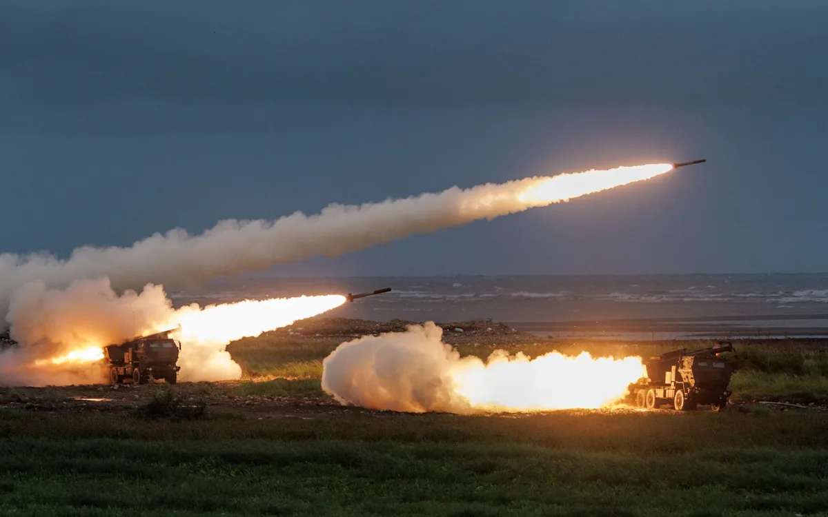 Taiwan's military personnel preparing to launch Himars missiles towards China, marking a significant escalation in tensions between the two nations, with the primary focus on testing the missile system's capabilities and accuracy in various scenarios, including the colour and behaviour of the situation