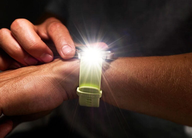 A person struggling to connect their Garmin smartwatch to their smartphone, with a frustrated expression, highlighting the connectivity issues caused by the Garmin Connect update