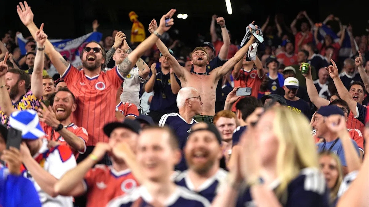Scotland players celebrating their historic World Cup win, with fans waving flags and cheering in the background, as the team makes history with their first victory in 28 years, a moment that will be remembered for years to come, with the primary keyword being Scotland World Cup