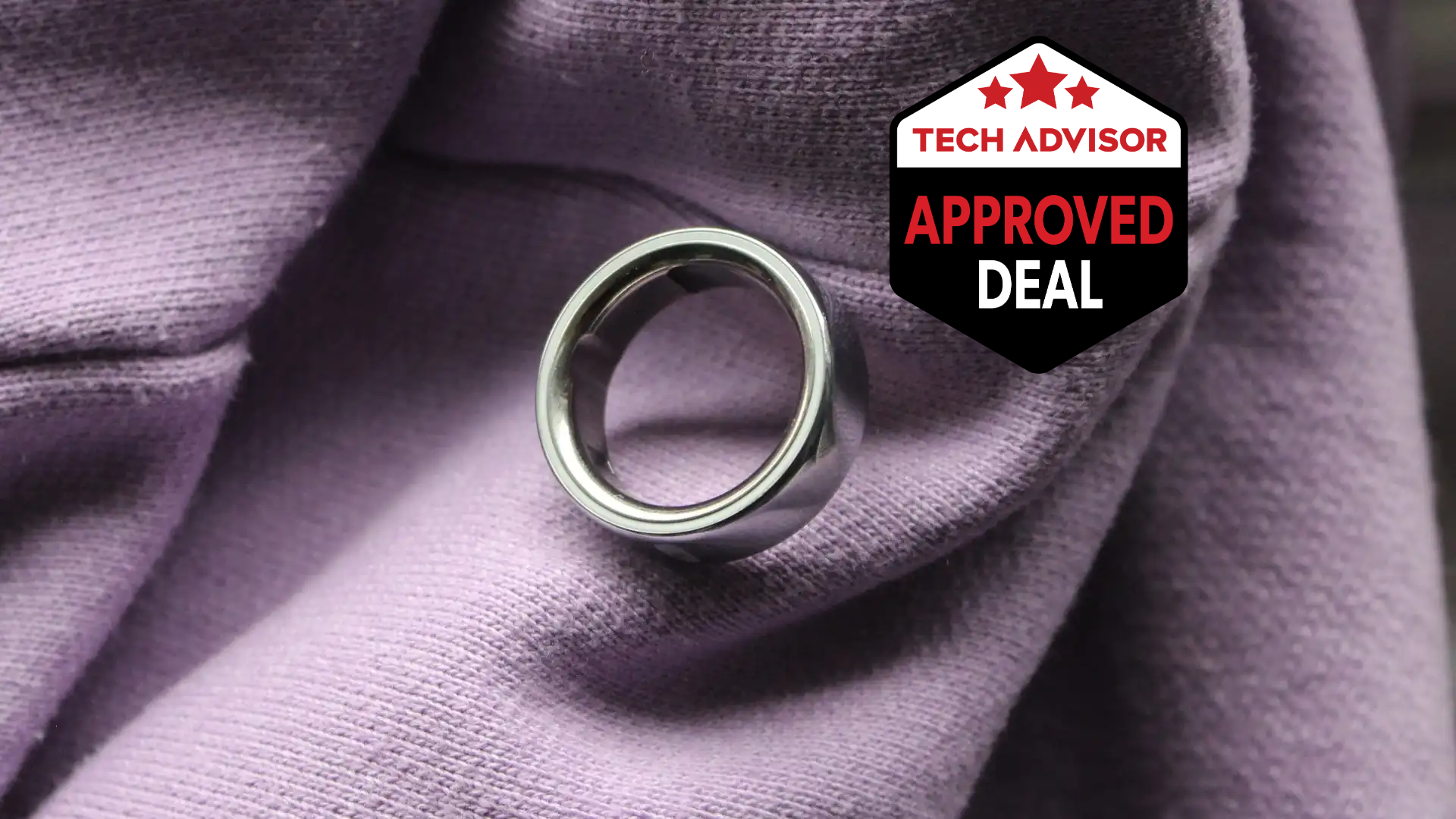 Oura Ring 4 displayed on a wooden surface with a UK flag background, highlighting the 50% Prime Day discount price