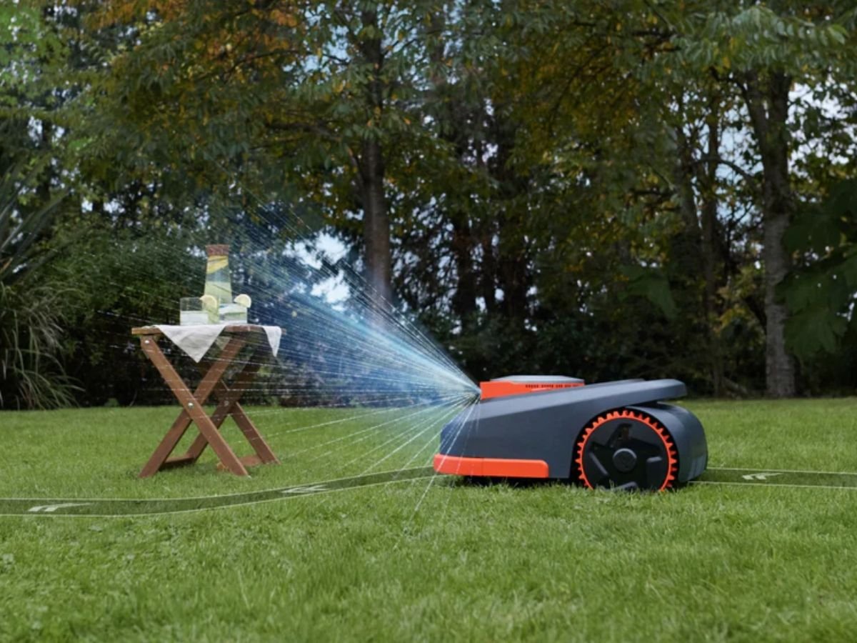 The Segway Navimow H2 series robotic lawn mower, featuring triple fusion navigation and advanced features for a convenient and efficient lawn mowing experience, with a lush green lawn and a beautiful garden in the background, showcasing the perfect lawn care solution