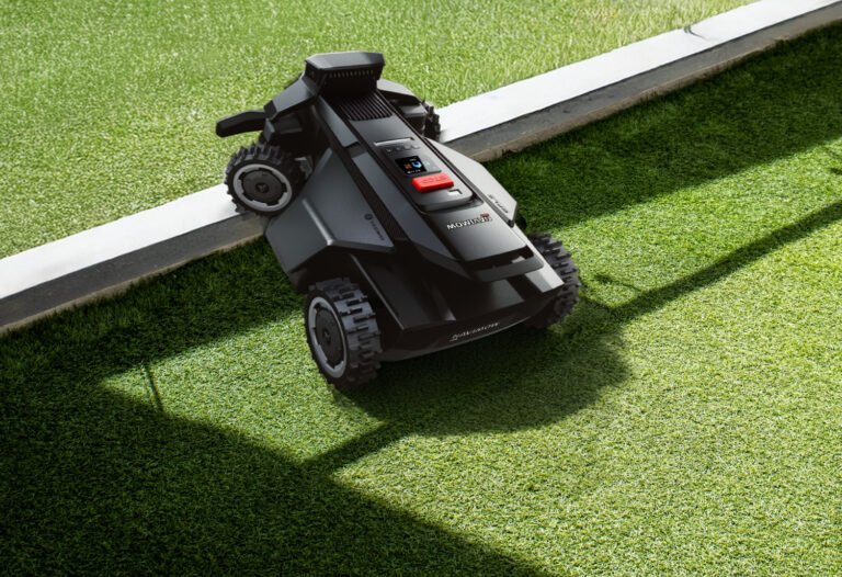 The Segway Navimow X4 robotic lawn mower in action, navigating a large lawn with ease, showcasing its four-wheel drive system and advanced cutting technology, a perfect solution for lawn care and maintenance