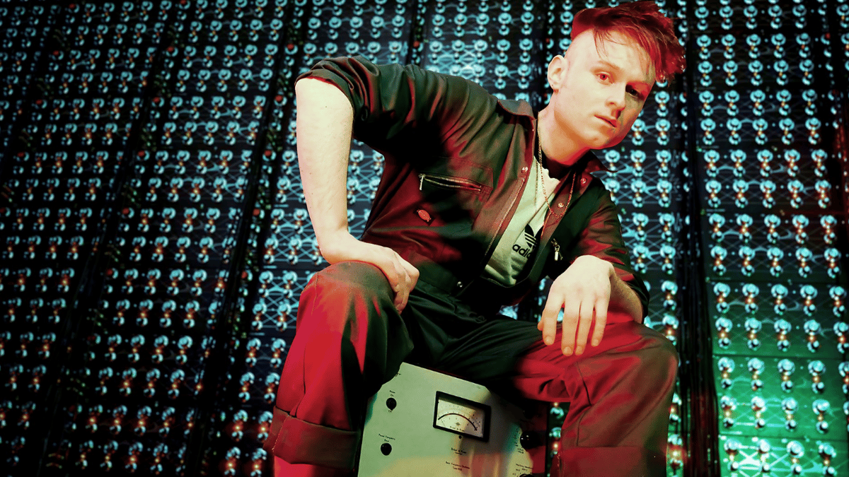 Look Mum No Computer, the experimental singer and YouTuber chosen to represent the UK at Eurovision 2026, posing with their signature equipment, showcasing their colourful and quirky behaviour, ready to analyse and captivating the audience with their music