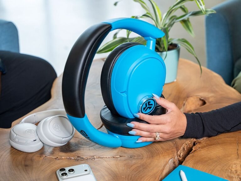 The JLab Blue XL Bluetooth speaker, a limited-edition device with a distinctive design resembling giant headphones, featuring 30W of audio power and a compact, portable build, perfect for outdoor gatherings and indoor parties, with a unique and functional design that showcases JLab's commitment to innovation and quality