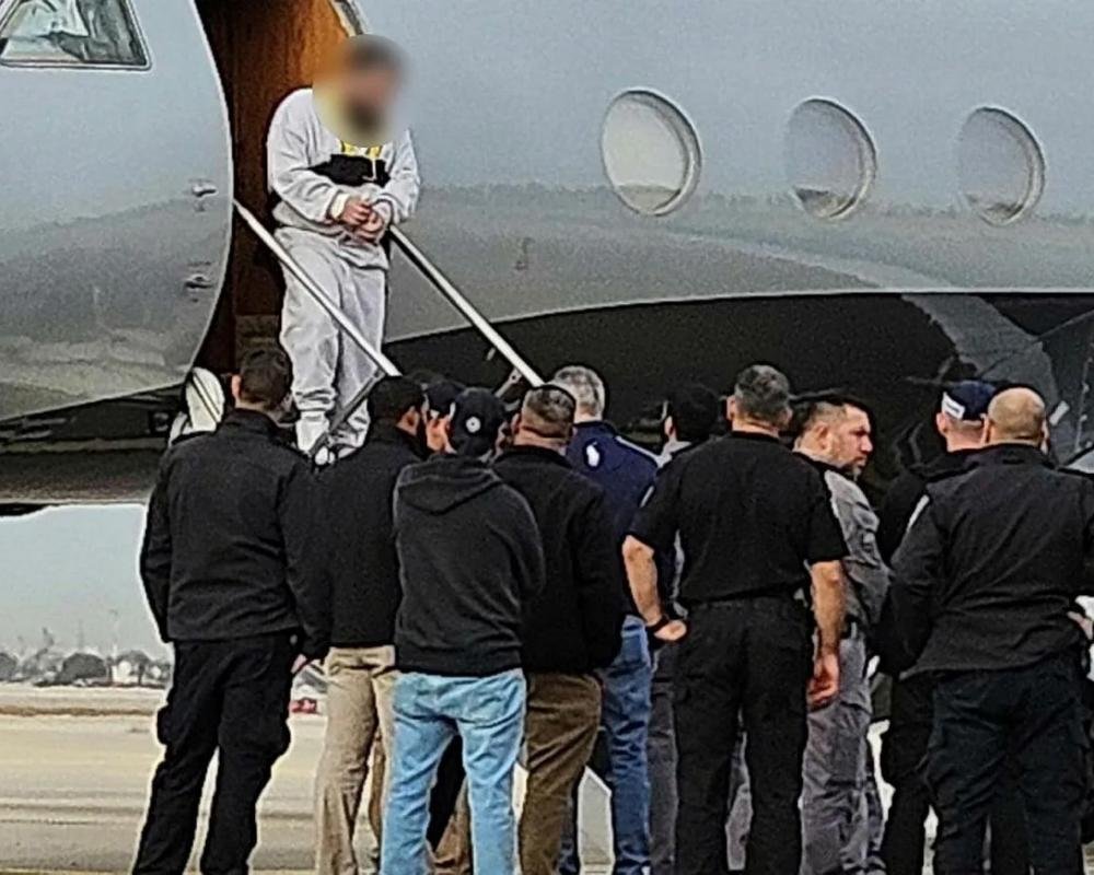 A plane taking off from an Irish airport, with a focus on the deportation of Palestinians and the role of ICE in the process, highlighting the need for greater transparency and accountability in the deportation process and the importance of human rights