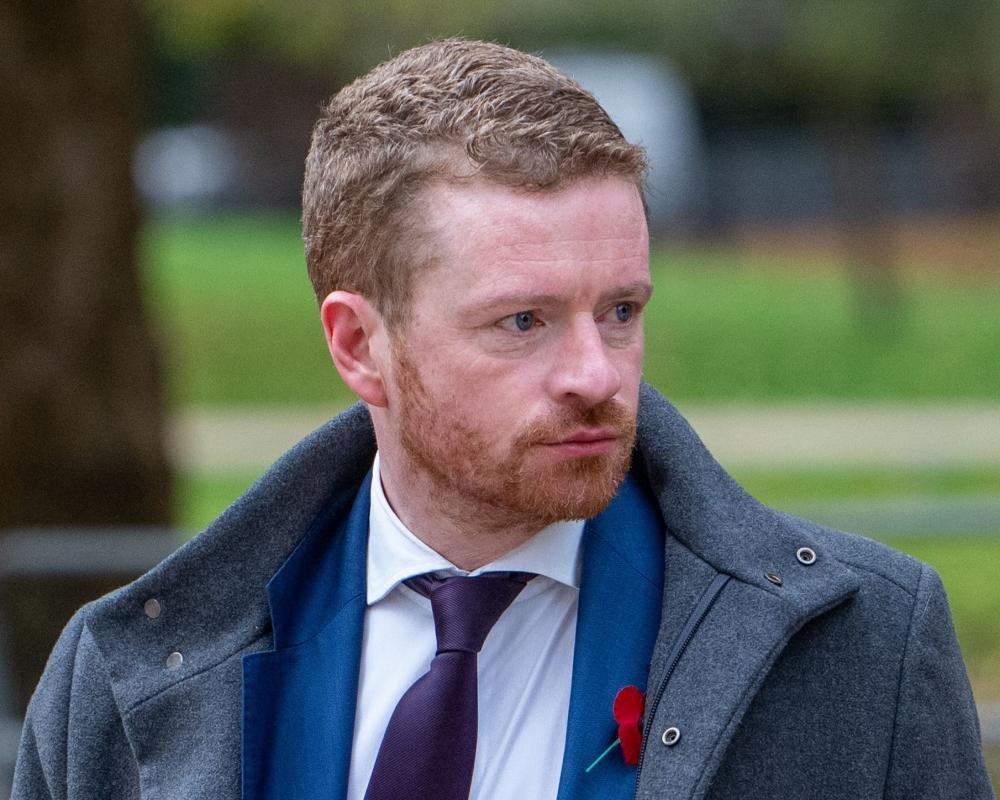 Morgan McSweeney, former chief of staff to Keir Starmer, resigns amidst Labour Party upheaval, leaving the party's future direction uncertain, with the Labour Party logo in the background, symbolising the party's colours and values