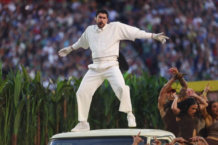 Bad Bunny performing at the halftime show, surrounded by colour and energy, sparking controversy and debate with his vibrant music and message, which has resonated with many, particularly in the Latinx community