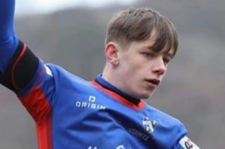 A sombre memorial in a Welsh village, with flowers and tributes laid in memory of a teenager who was tragically stabbed to death, highlighting the devastating impact of violent behaviour on communities