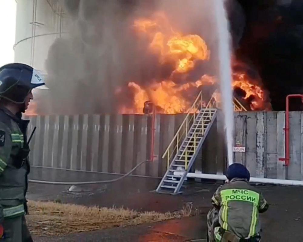 Aerial view of a Russian energy site, with a destroyed building in the foreground, highlighting the devastating impact of the Ukraine war on the country's infrastructure and the environment, as the conflict escalates and the international community watches with concern