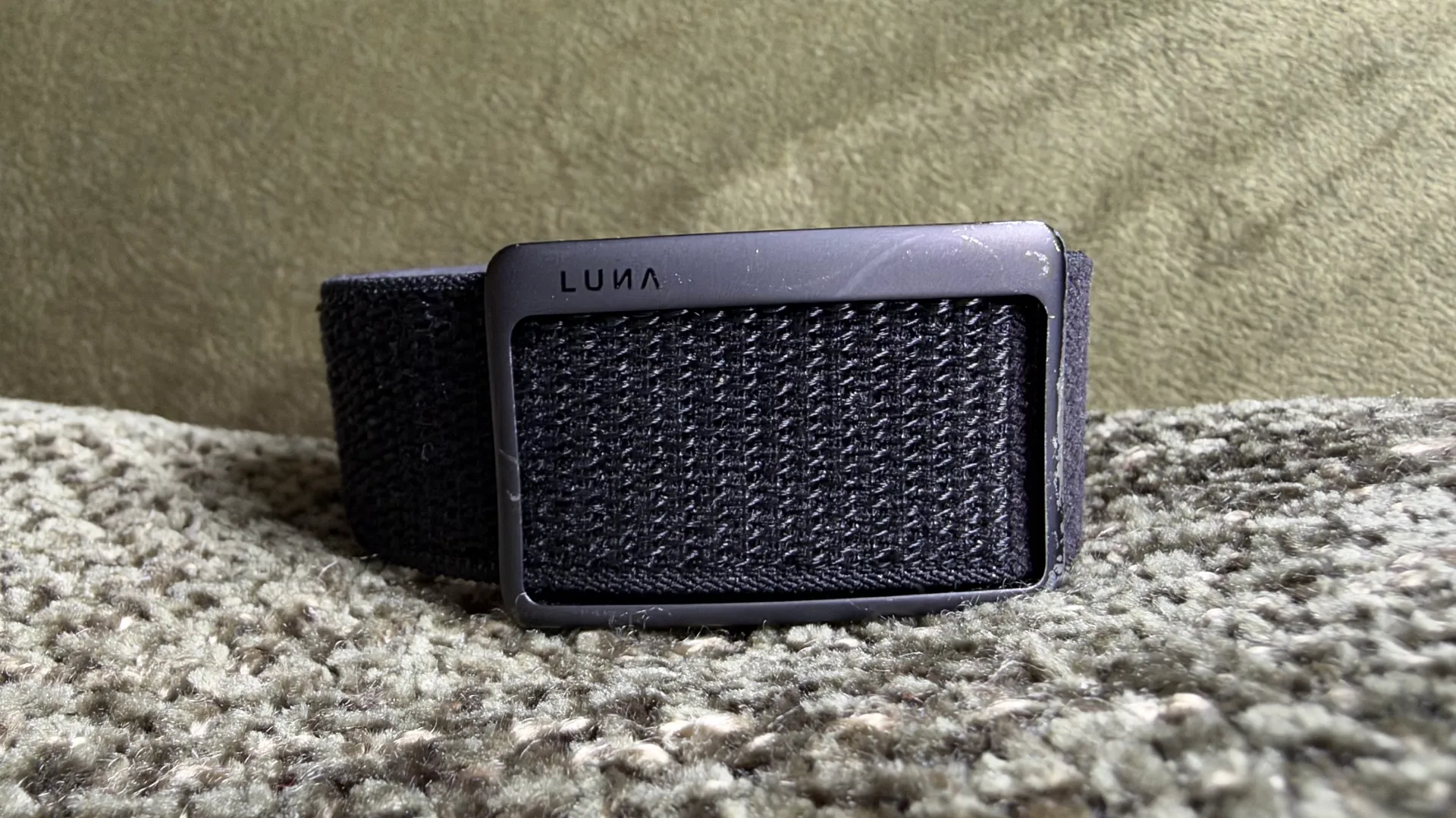 Luna Band fitness tracker on wrist with nylon strap and metal buckle