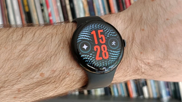 Google Pixel Watch 5 on wrist with charging dock