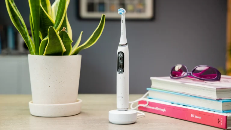 Two Oral-B iO toothbrush handles and heads in a twin pack on a white background