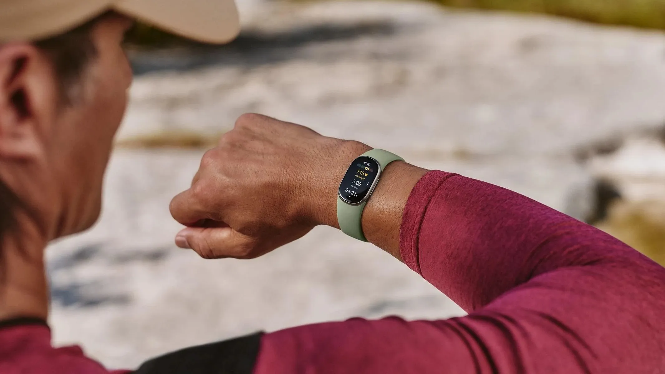 Close-up of the Fitbit Edge fitness tracker displaying its screen and strap