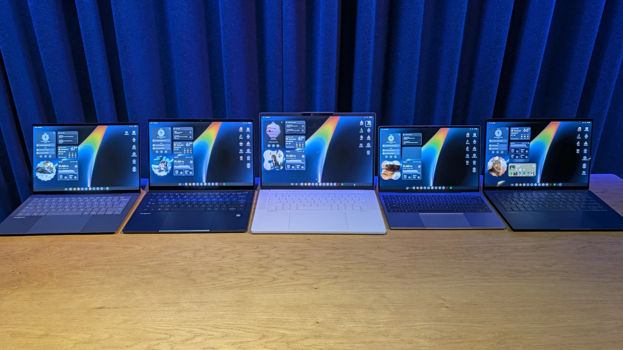 Samsung Galaxy S25 beside a prototype Googlebook laptop with OLED screen