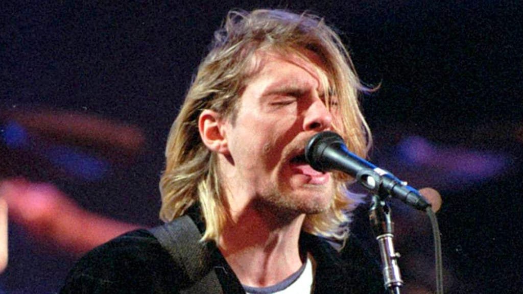 Kurt Cobain performing on stage with Nirvana, a descriptive image of the legendary musician in his element, with the primary keyword 'Kurt Cobain' featured naturally
