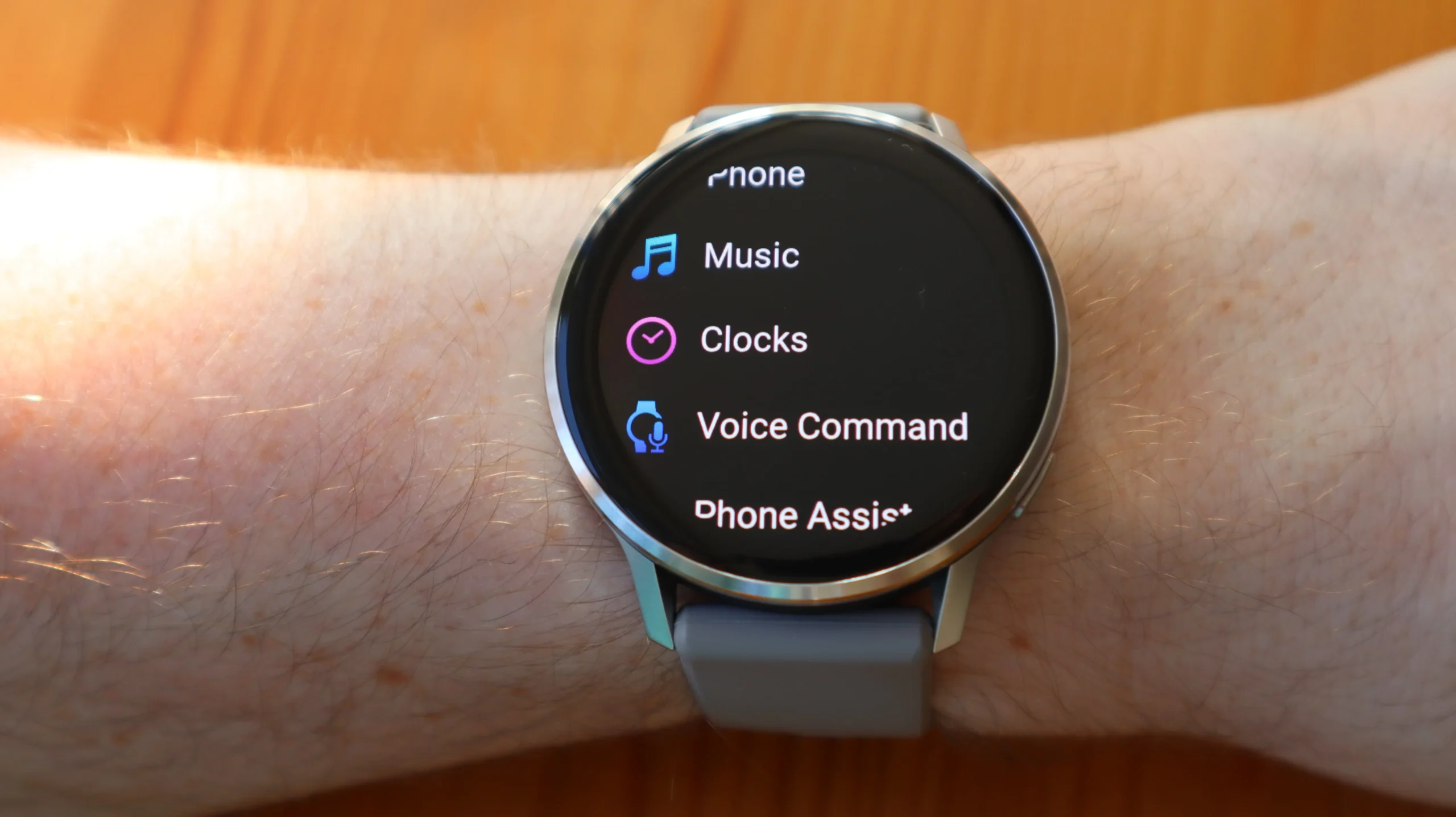 Garmin Fenix 8 smartwatch displaying OK Garmin voice activation screen