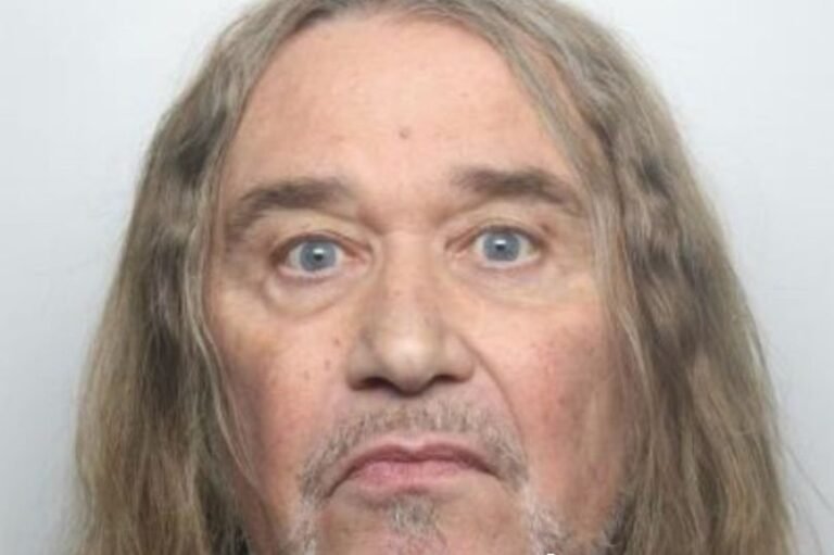 A sombre image of a prison cell, with a man sitting in the corner, highlighting the harsh reality of life behind bars and the need for rehabilitation and support to prevent recidivism