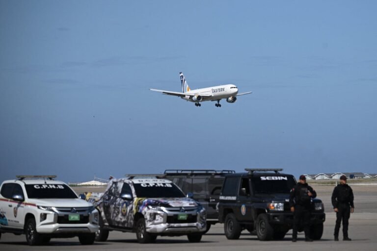 A group of migrants standing near a border fence, looking uncertain and worried about their future, as the Trump administration's relocation policy continues to spark debate and controversy, with many questioning the behaviour of the administration and the colour of the situation