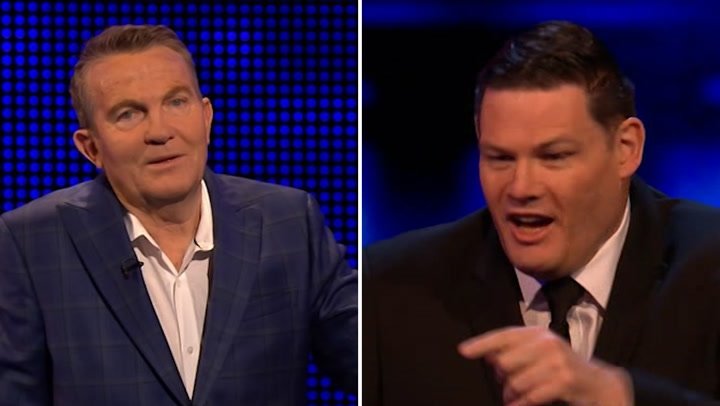 Mark Labbett and Bradley Walsh on the set of The Chase, a British game show where contestants test their knowledge and strategy, with a focus on The Chase and its unique format