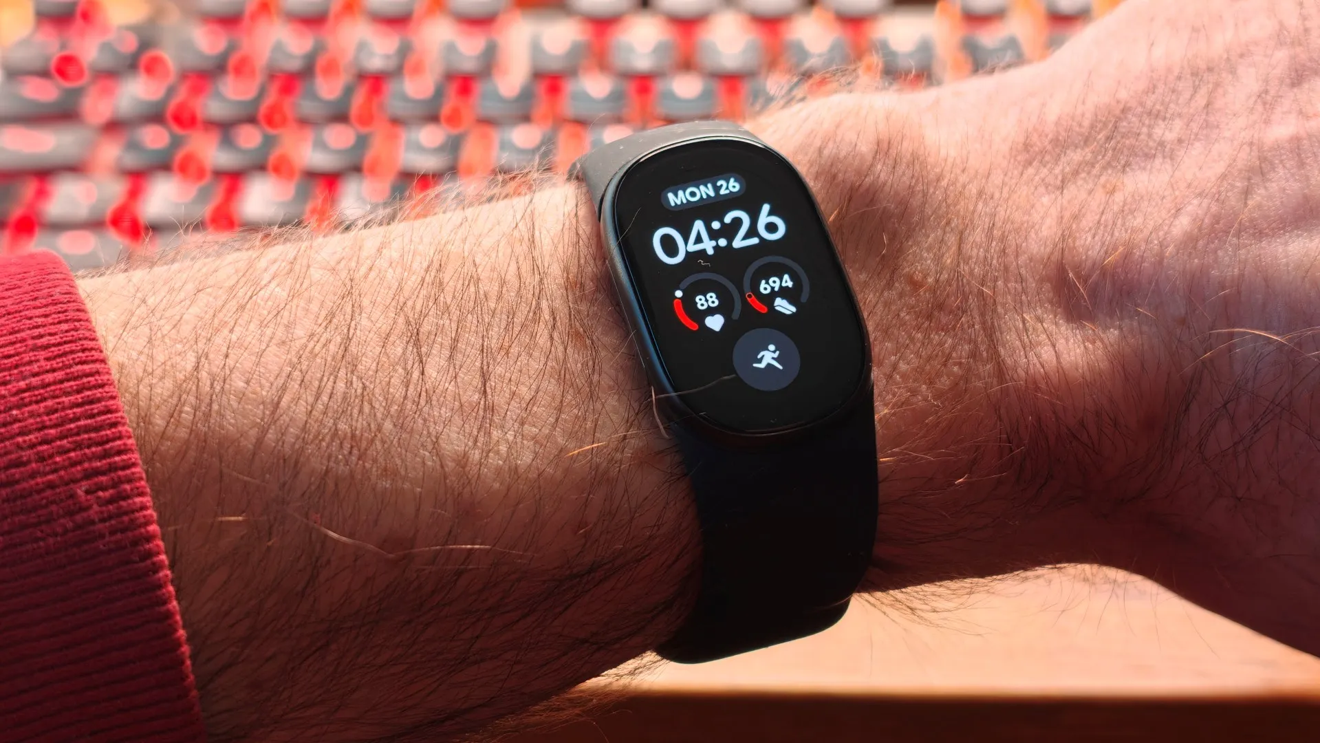 Fitbit Edge wearable next to Pixel Watch 5 on a wrist